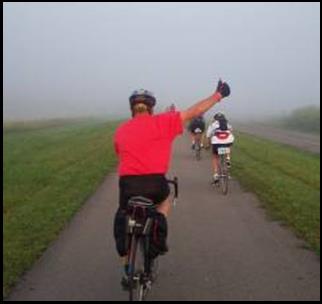 Corky Cusick, formerly of Prospect, enjoys a foggy rail trail during the 2002 Great Ohio Bicycle Adventure.